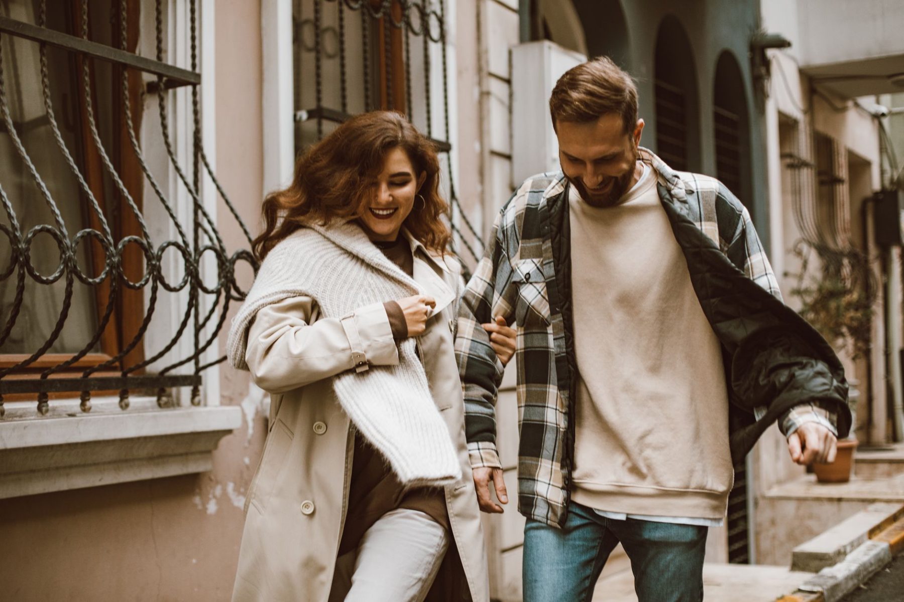 Happy couple walking outdoors representing a healthy relationship