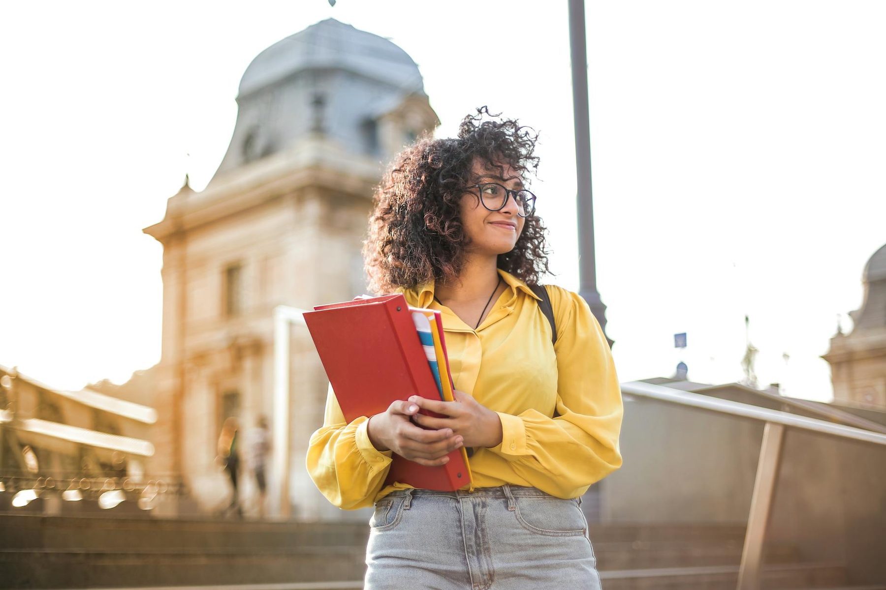 Woman holding books preparing for tertiary education