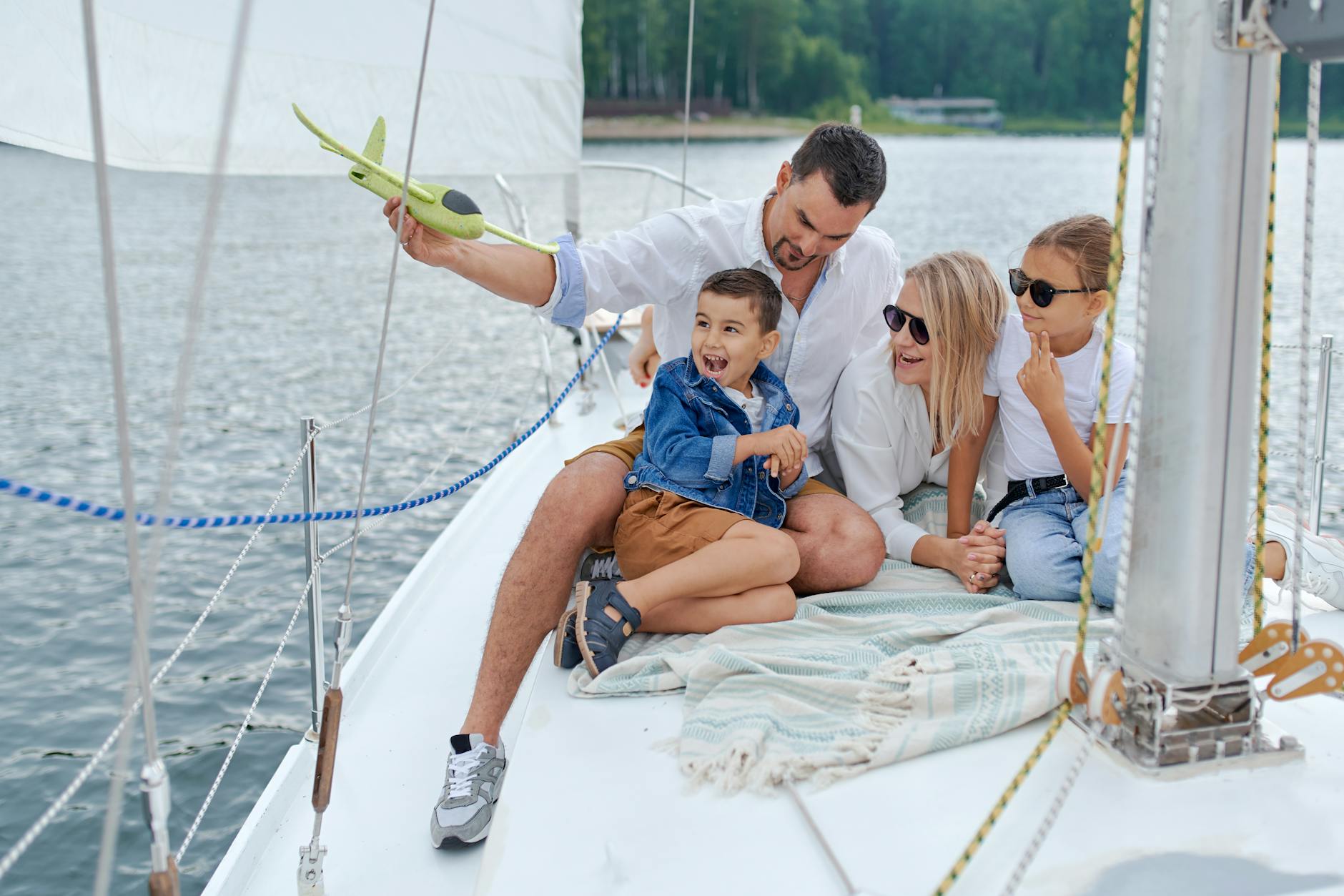 Happy family on a sailboat representing becoming a stepparent